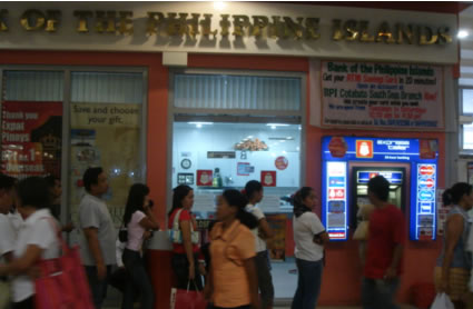 Customers line up at BPI - ATM machine at South Seas Mall, Cotabato City, Philippines